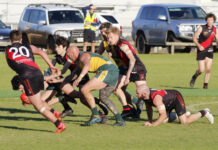 Action from the A Grade match between Kingscote and Dudley United