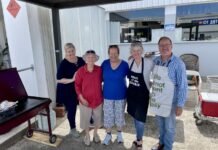 Betty gives back to Angel Flight with Mitre 10 sausage sizzle