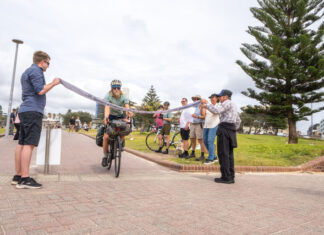 Nic Tremaine finishes his year-long 47,200 km ride at Bondi Beach