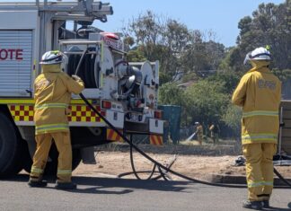 Grassfire sparked on vacant block as construction of government housing begins